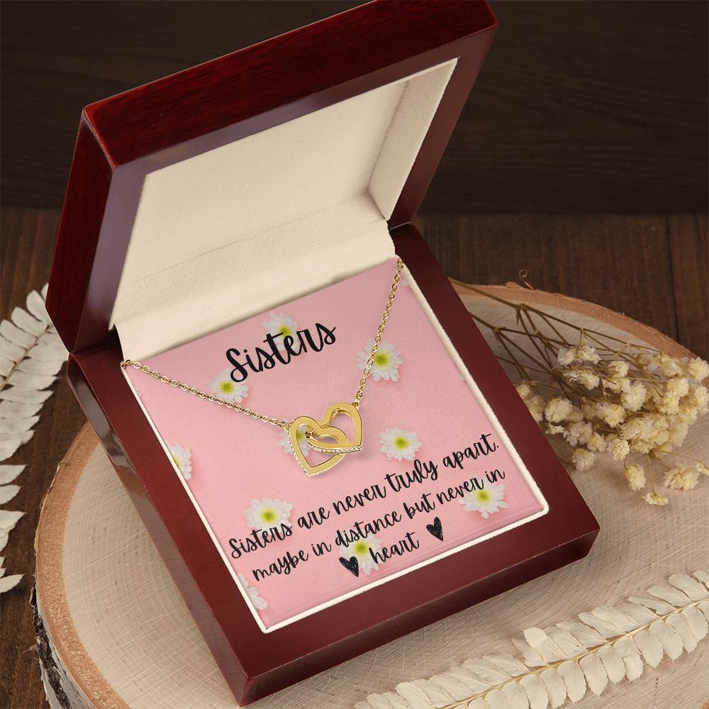 Sisters - Interlocking Necklace - Daisy Background Interlocking Hearts Necklace