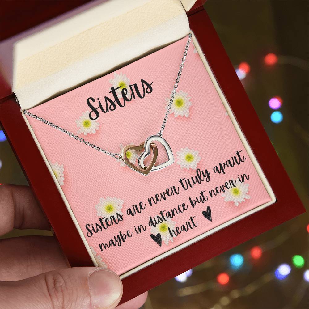 Sisters - Interlocking Necklace - Daisy Background Interlocking Hearts Necklace