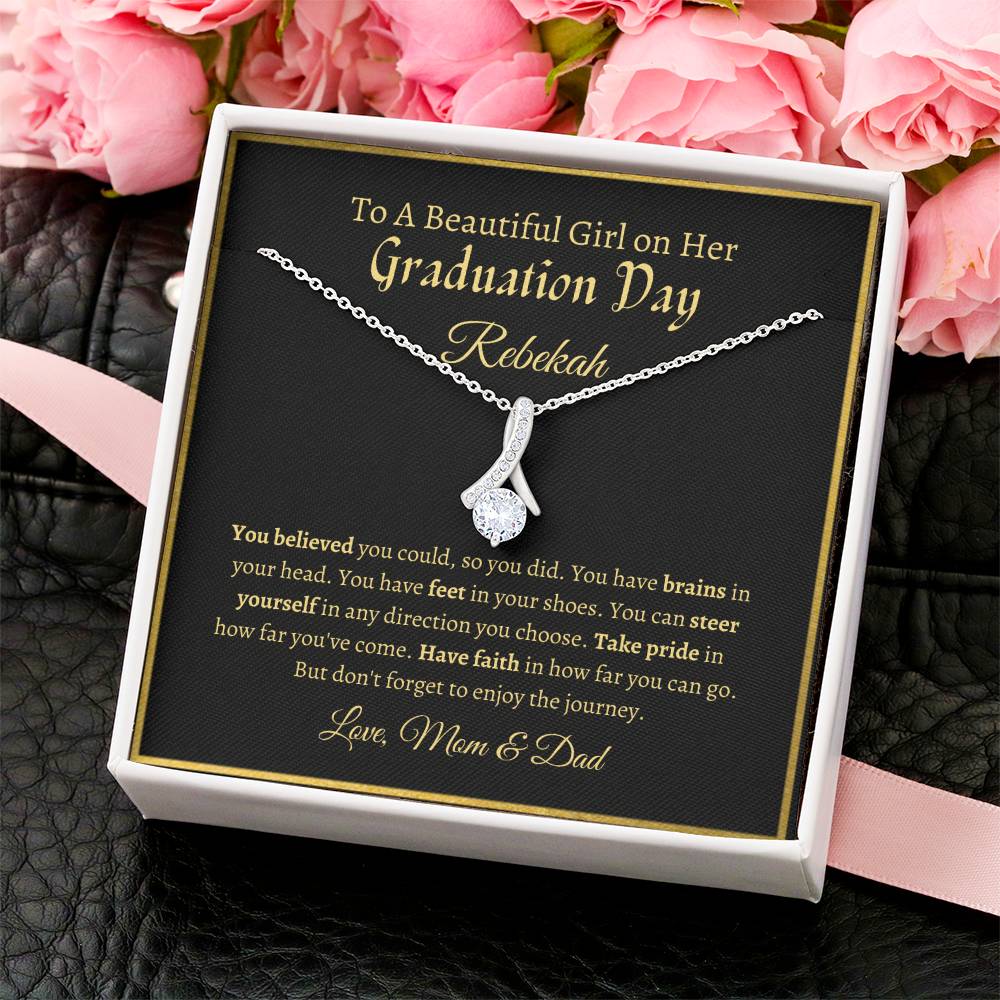 To A Beautiful Girl On Her Graduation Day -  Ribbon Necklace - Love Mom & Dad Alluring Beauty Necklace
